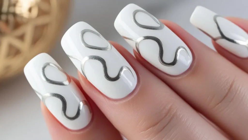 White nails with silver snake outlines